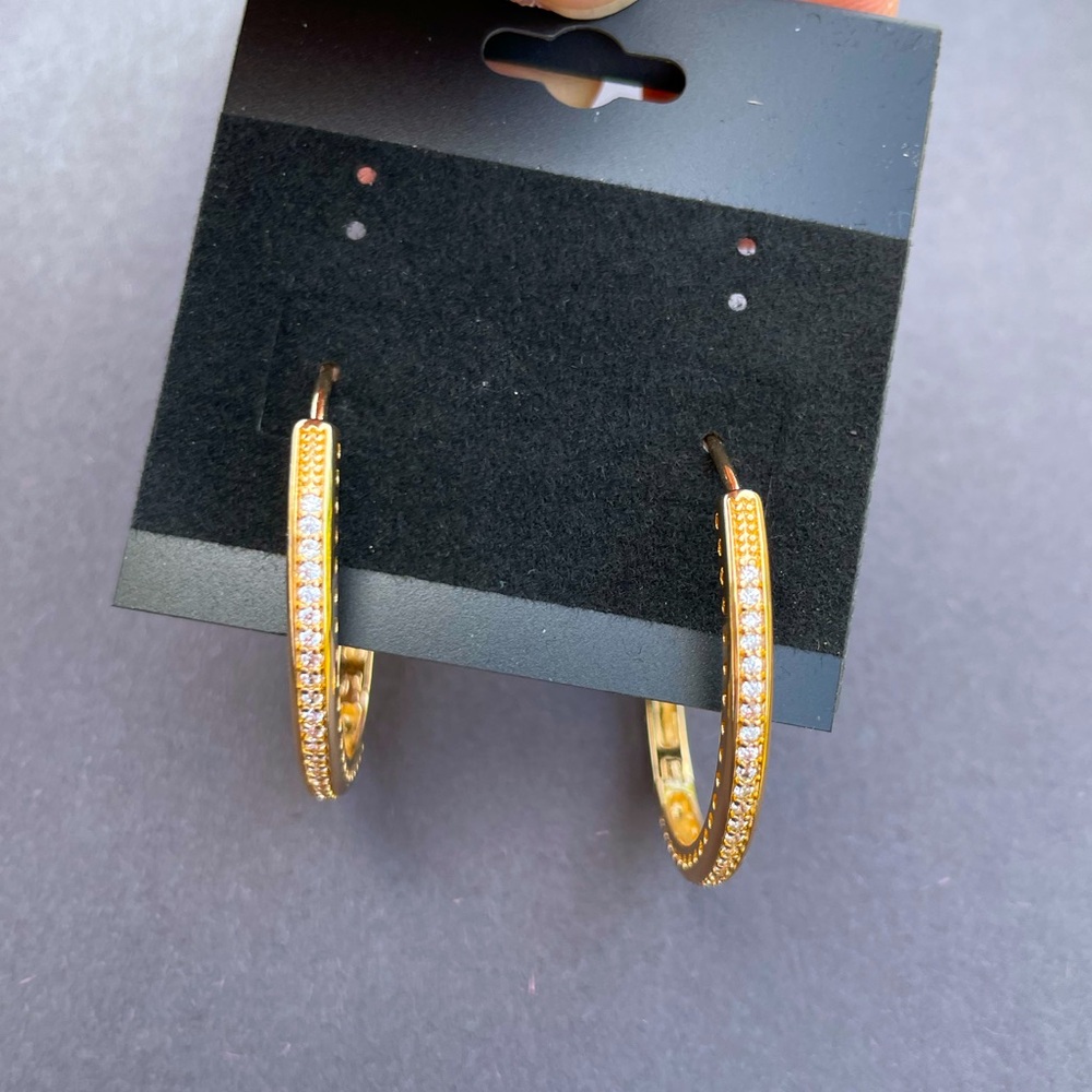 Golden hoop earrings with cubic zirconia